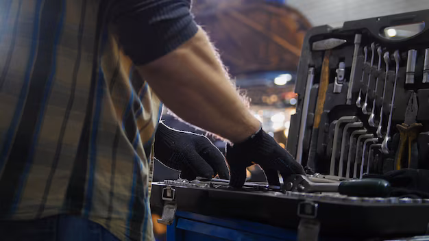 car-service-mechanic-man-looking-tool-case